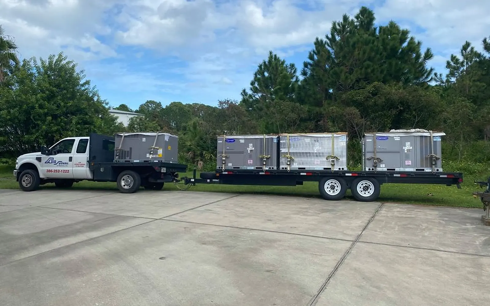 Air Systems of Daytona truck delivering new condensers to a job